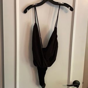 Cross body bodysuit. NEVER WORN